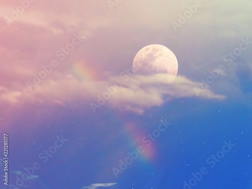 Beautiful rainbow with moon on the sky. © Mallika