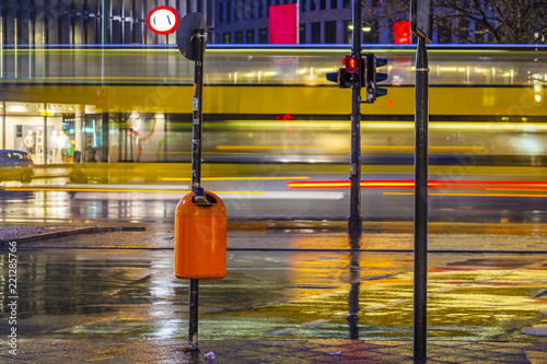 Photography Kudamm in berlin with blurred bus and reflection in street by night