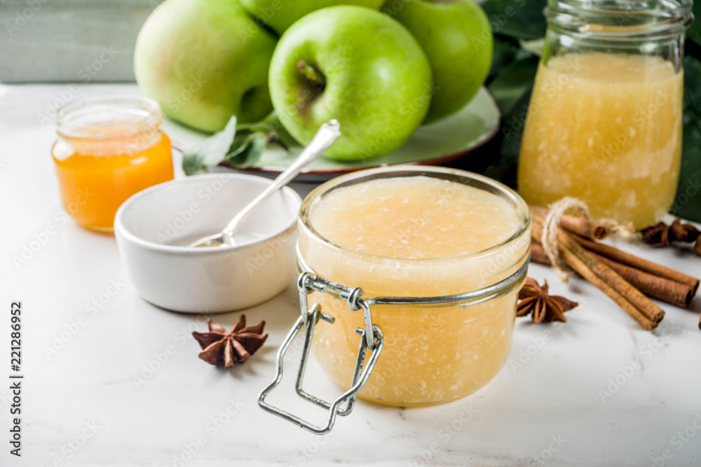 Homemade apple jam or sauce, with green apples and spices Homemade apple jam or sauce, with green apples and spices