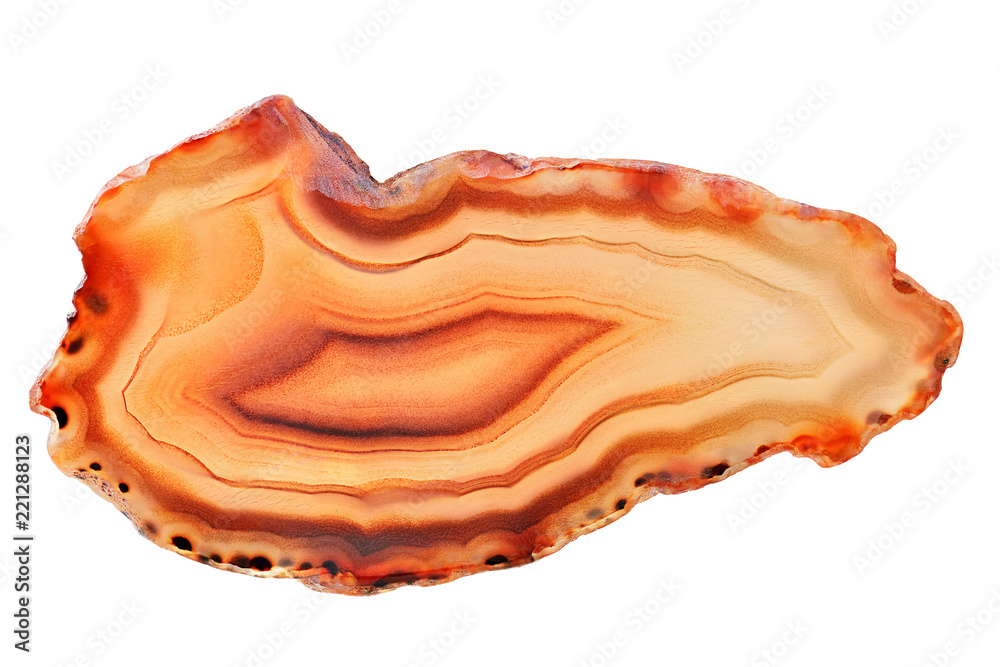 Amazing orange Agate Crystal cross section from Madagascar with backlight isolated on white background. Natural translucent agate crystal surface,  Abstract structure slice mineral stone macro closeup