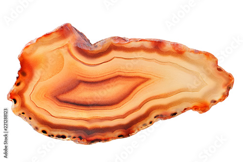 Amazing orange Agate Crystal cross section from Madagascar with backlight isolated on white background. Natural translucent agate crystal surface   Abstract structure slice mineral stone macro closeup