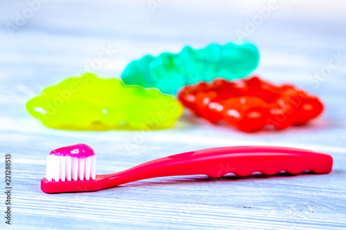 children s toothbrush oral care on wooden background