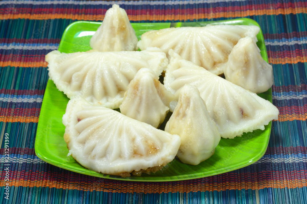 Kozhukatta or Kozhukkattai is a popular Indian Sweet dish made from rice flour and filled with grated coconut and jaggery. Kozhukatta or Kozhukkattai is a popular Indian Sweet dish made from rice flour and filled with grated coconut and jaggery.