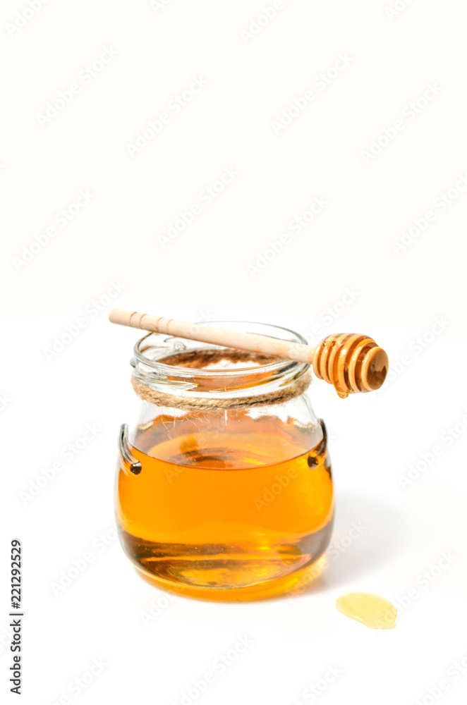 Natural fresh honey and honey spoon on white background. Natural fresh honey and honey spoon on white background.