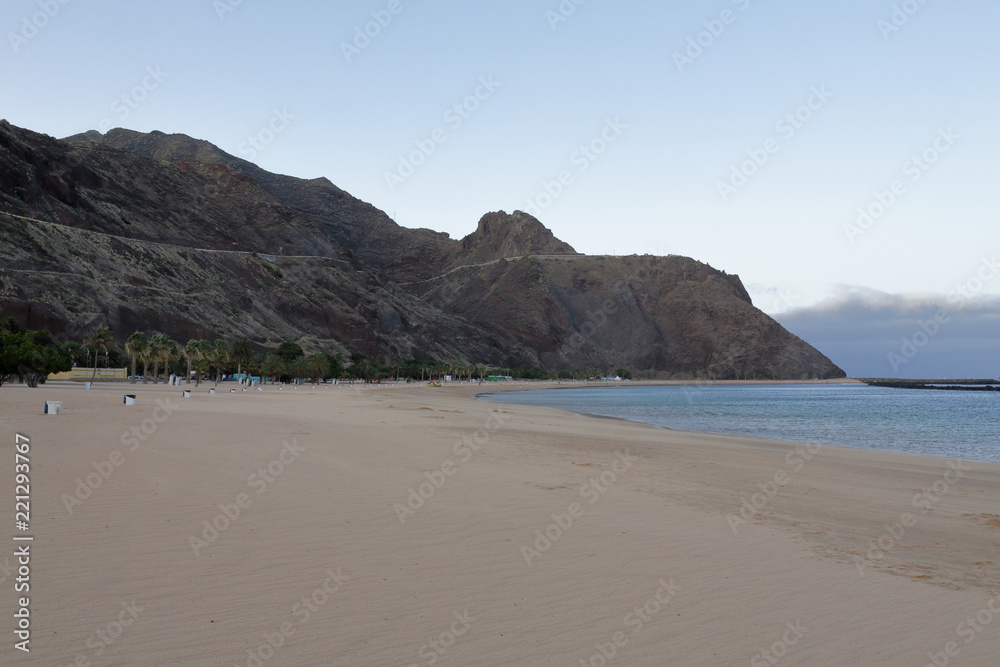 A landscape of the yellow sand and mountains of Playa de Las Teresitas, next to San Andres and Santa Cruz cities, in Tenerife, Canary islands A landscape of the yellow sand and mountains of Playa de Las Teresitas, next to San Andres and Santa Cruz cities, in Tenerife, Canary islands