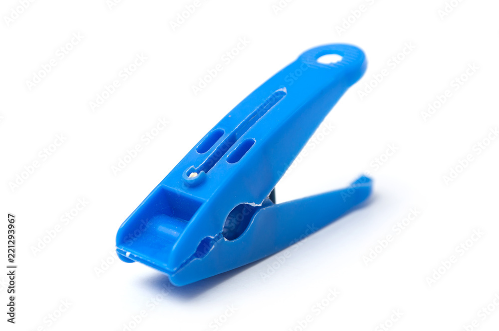 closeup of blue plastic clothespin on white background closeup of blue plastic clothespin on white background