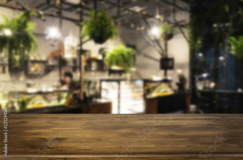 Selected focus empty brown wooden table and Coffee shop or restaurent blur background with bokeh image. for your photomontage or product display © snowing12