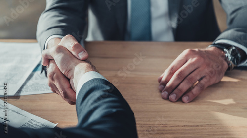 cropped shot of business partners shaking hands