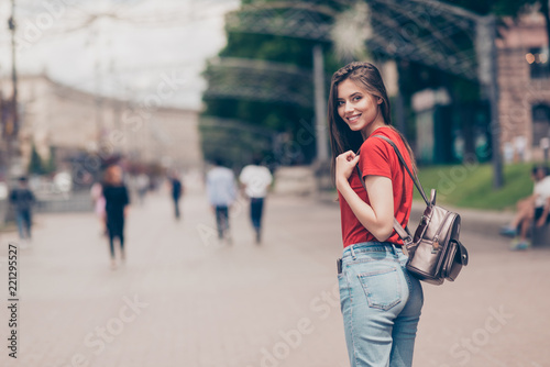 Straight-haired young beautiful smiling girl wearing casual red © deagreez