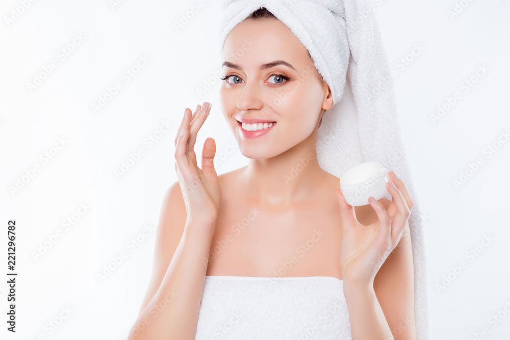 Portrait of charming woman in towel and turban on head, applying Portrait of charming woman in towel and turban on head, applying