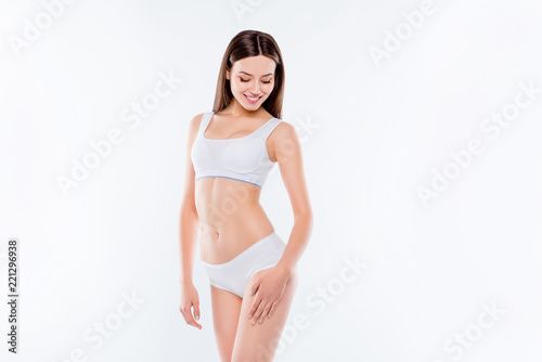 Portrait of thin sportive woman with perfect body in white cotto
