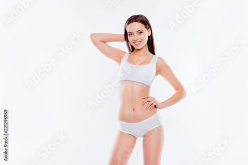 Portrait of fit slender woman with perfect body in white cotton