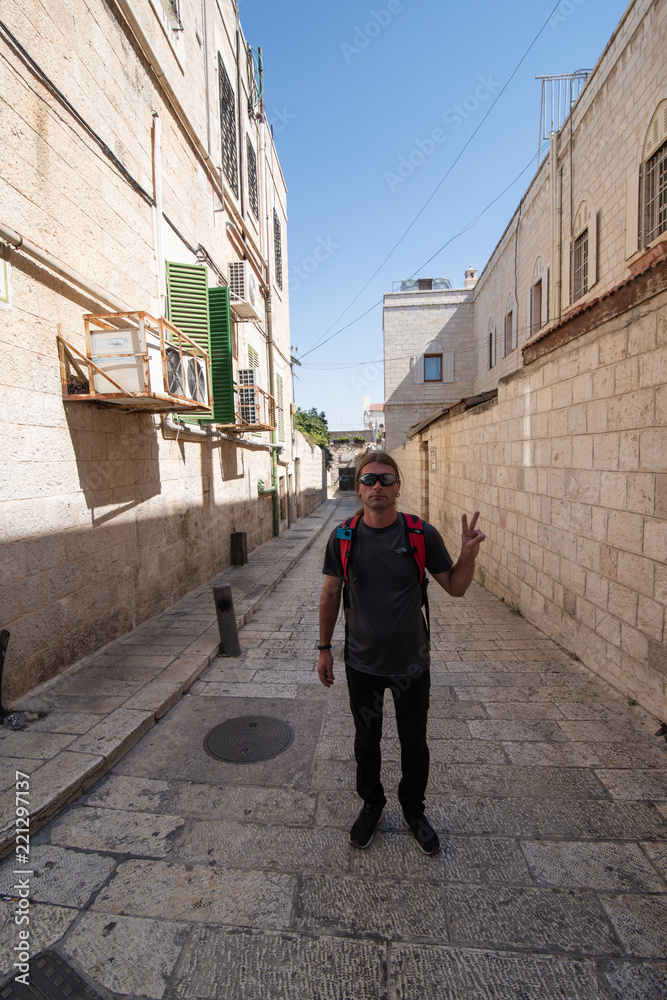 Portrait of man showing victory sign in the Old Center of Jerusalem Portrait of man showing victory sign in the Old Center of Jerusalem