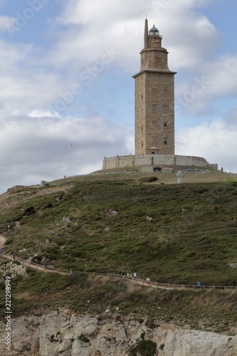 Landscape of Tower of Hercules in the Galicia capital city La Coruña on its rocks promontory on the sea © Isacco