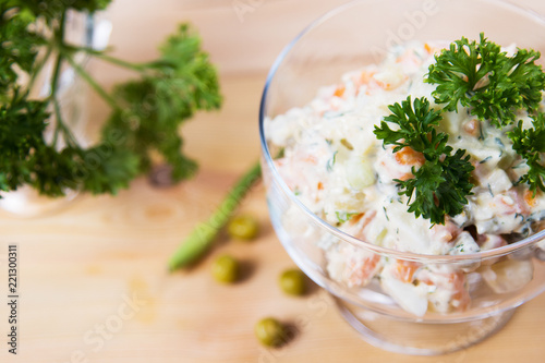 Salad, green peas, mayonnaise, greens,cucumbers, sour cream