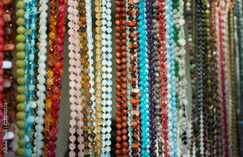 Jewelry made of natural stones in a street shop.