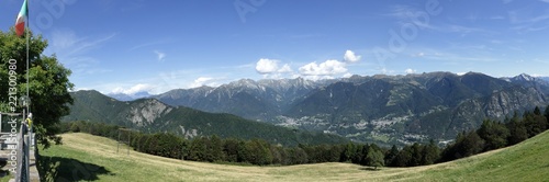 A landscape of green mountains, with pines and firs, rocks and glaciers, in the Vigezzo Valley, northern Italian Alps