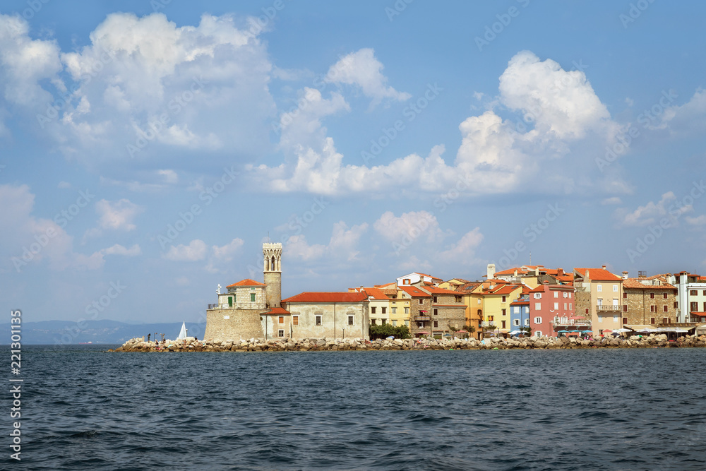 Lighthouse and church in Piran, Slovenia, view from the sea