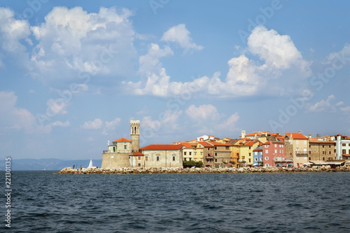 Lighthouse and church in Piran, Slovenia, view from the sea