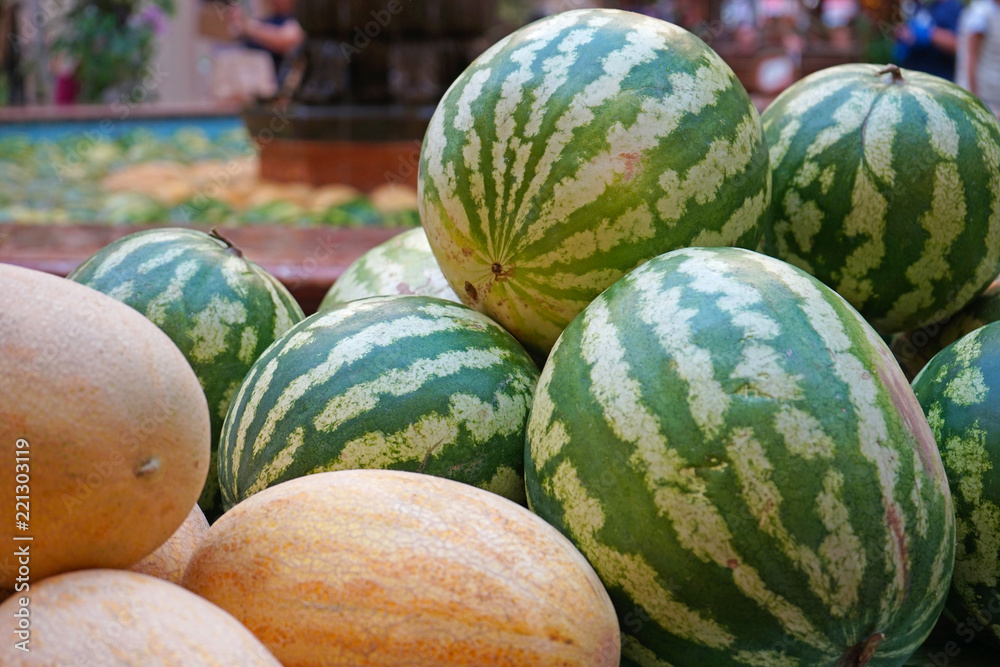 Ripe watermelons and melons at the seasonal fair.