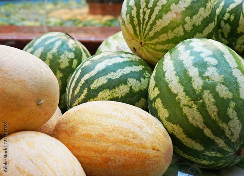 Ripe watermelons and melons at the seasonal fair.