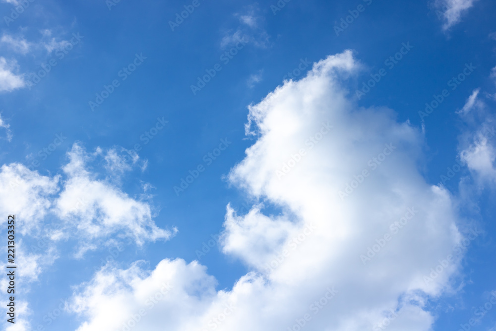 White fluffy clouds and blue sky on hot summers day White fluffy clouds and blue sky on hot summers day