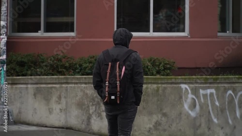 Man with a backpack walks around the New York