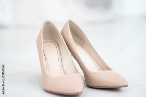 Beige shoes. Wedding Shoes. Bride shoes on heel. The bride's fees. Wedding decorations