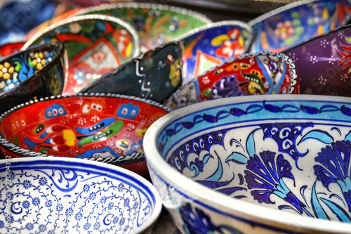 Bright handmade decorative painted ceramic plates of different motifs