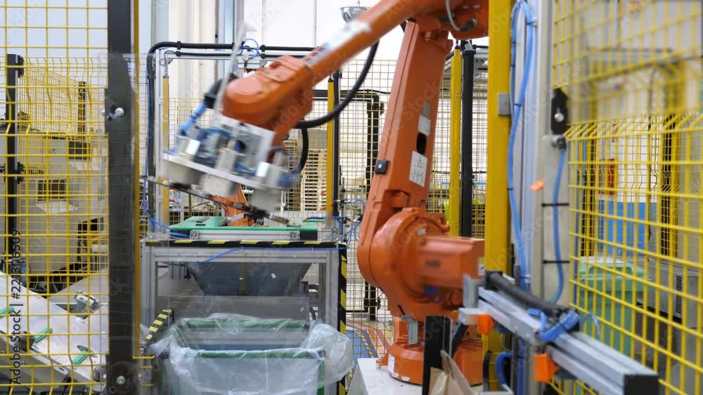 Industrial footage, robotic arm at work. Fully automated factory