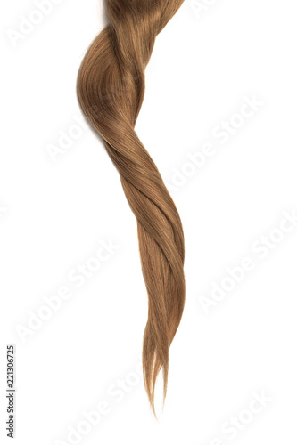 Brown hair isolated on white background. Long twisted ponytail