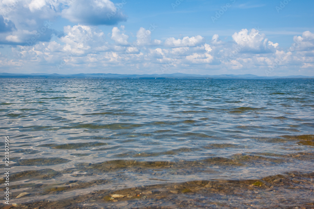 Fototapeta premium Calm beautiful landscape of blue lake and white clouds