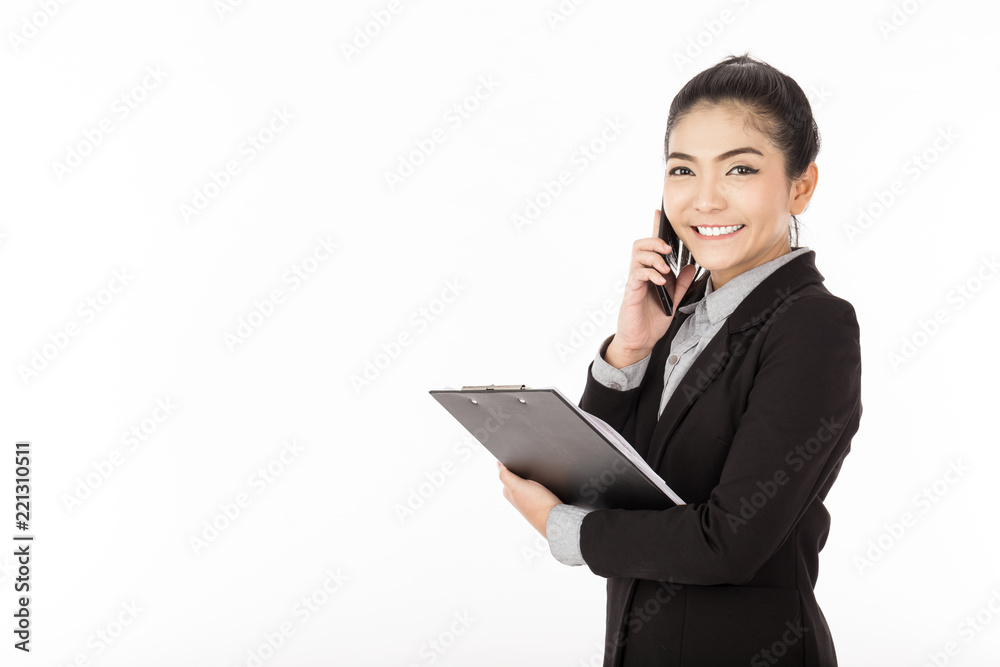 Asian young business woman wearing black suit smile and talk in smartphone with customer to get requirement and hold document in her hand,Feeling confident and having a service mind,Isolated on white Asian young business woman wearing black suit smile and talk in smartphone with customer to get requirement and hold document in her hand,Feeling confident and having a service mind,Isolated on white