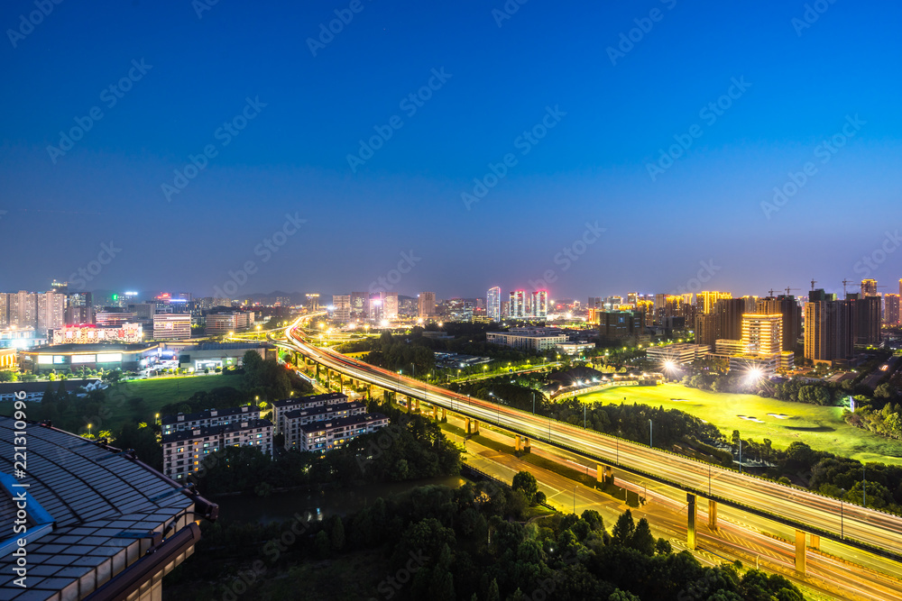 Fototapeta premium busy traffic road with city skyline in hangzhou china