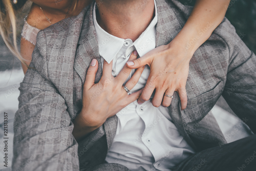 woman is hugging her man husband with hands