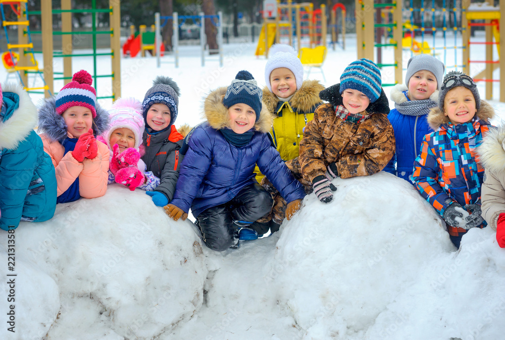friendly group of children playing at the winter playground