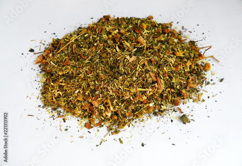 Bright multi-colored dry herbal herbal mixture on a white background from different plants