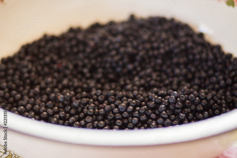 A lot of blueberries in a large bowl close-up A lot of blueberries in a large bowl close-up