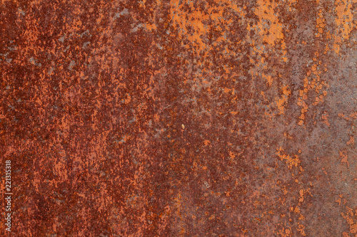 Rusty yellow-red textured metal surface. The texture of the metal sheet is prone to oxidation and corrosion. Textured Background in Grunge Style