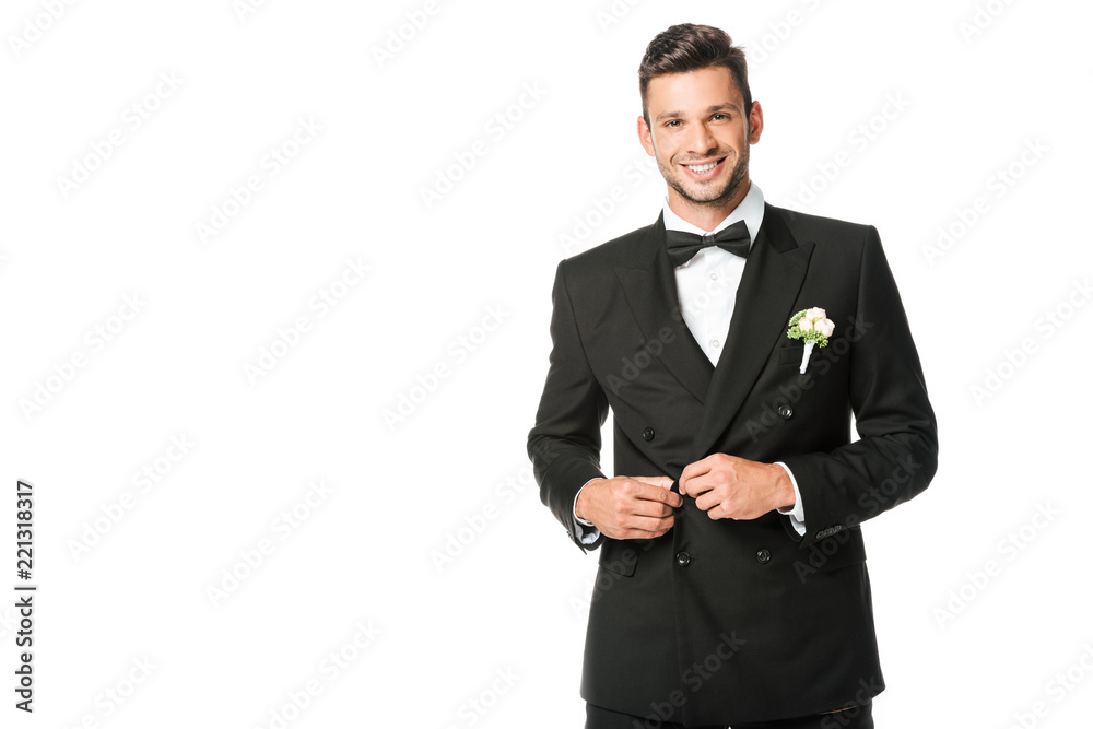 happy groom buttoning suit and looking at camera isolated on white happy groom buttoning suit and looking at camera isolated on white