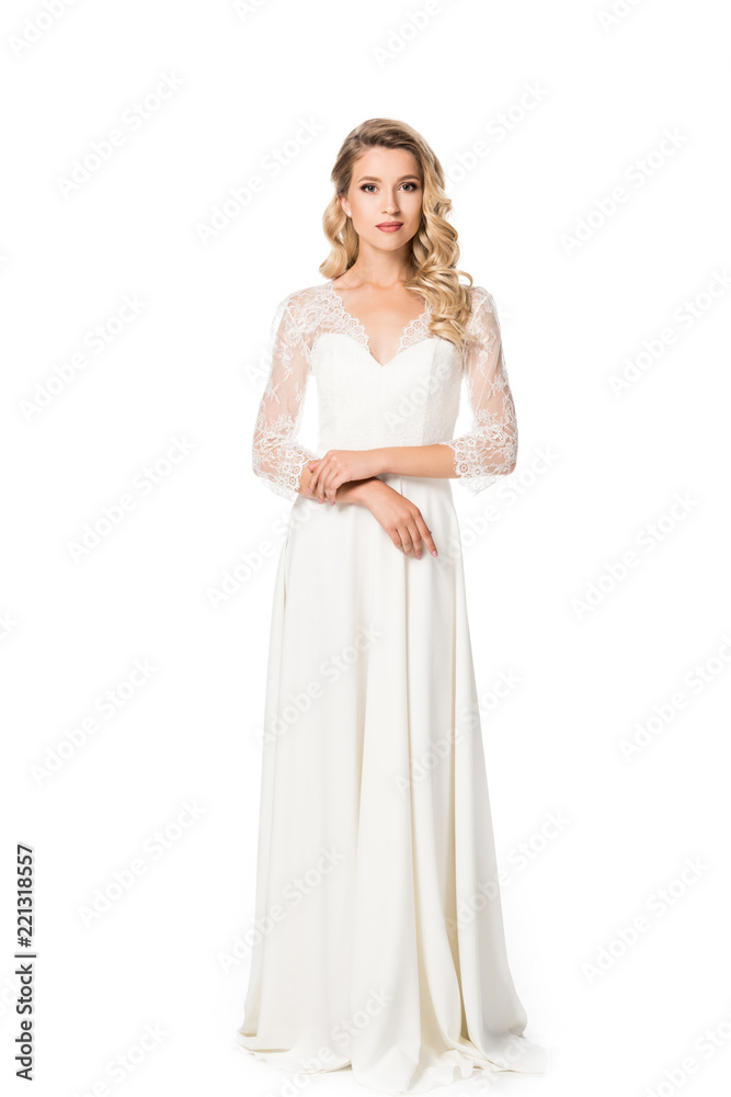 young bride in wedding dress looking at camera isolated on white