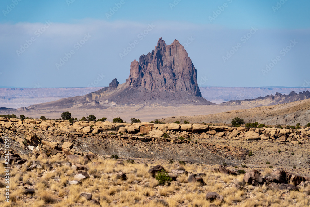 Shiprock sacred rock formation in the Four Corners region of the New Mexico Desert. Sunny clear day Shiprock sacred rock formation in the Four Corners region of the New Mexico Desert. Sunny clear day