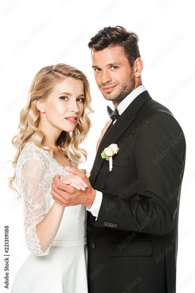 smiling young bride and groom dancing isolated on white smiling young bride and groom dancing isolated on white