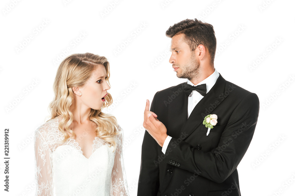 groom showing middle finger to shocked bride isolated on white groom showing middle finger to shocked bride isolated on white