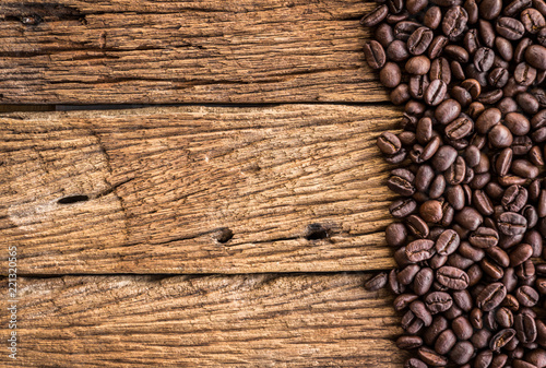 Coffee beans on old wood plank