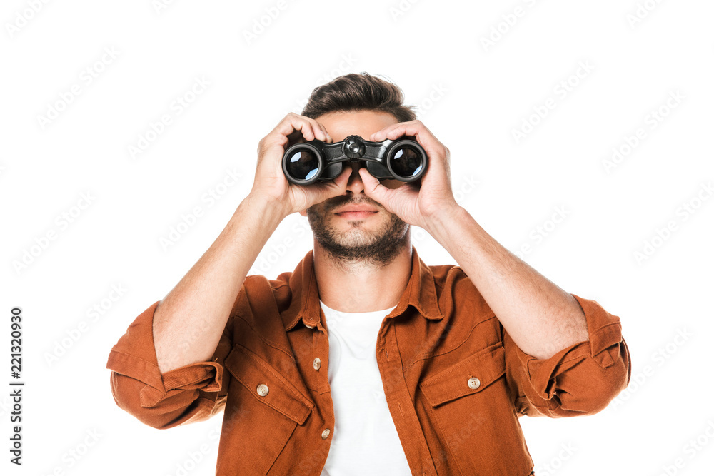 handsome young man looking at camera with binoculars isolated on white handsome young man looking at camera with binoculars isolated on white
