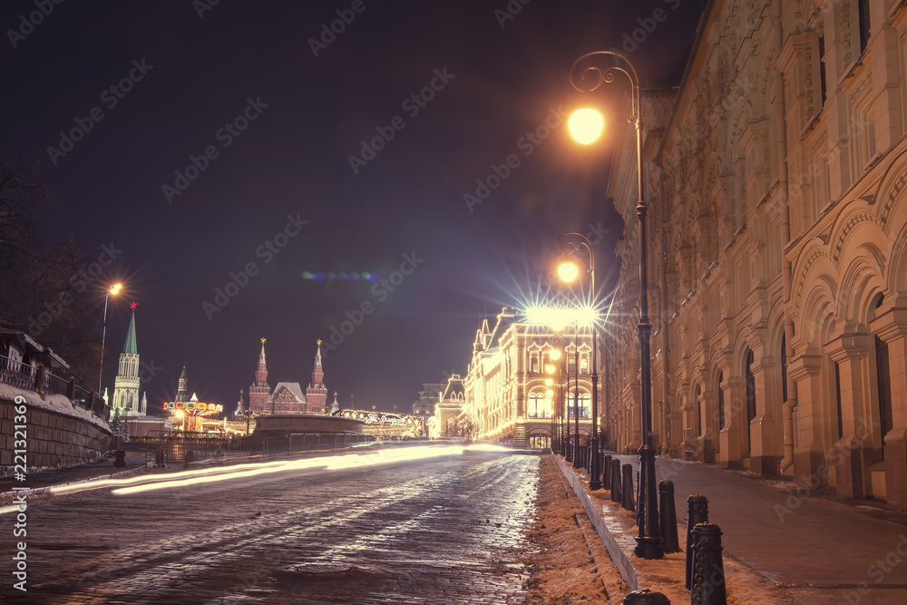Night Moscow street on Christmas. Winter in Moscow city. GUM on red square illuminated celebrate lights. Decorations on street and beautiful lanterns. Capital of Russia at night in New Year.