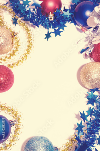 Multicolored Christmas balls with tinsel on a white background