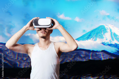 Young Man Using Virtual Reality Glasses See a Simulation image 3D beautiful landscape view