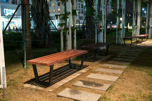 Wooden bench in the park at night